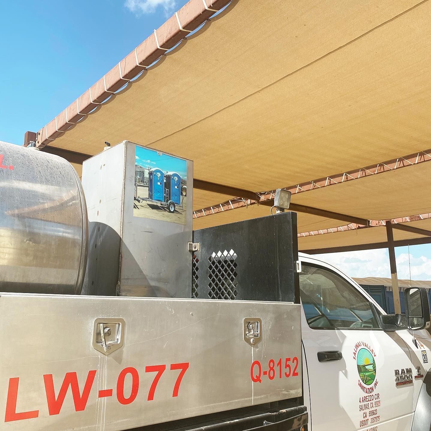 A white truck with the numbers lw-077 on the back
