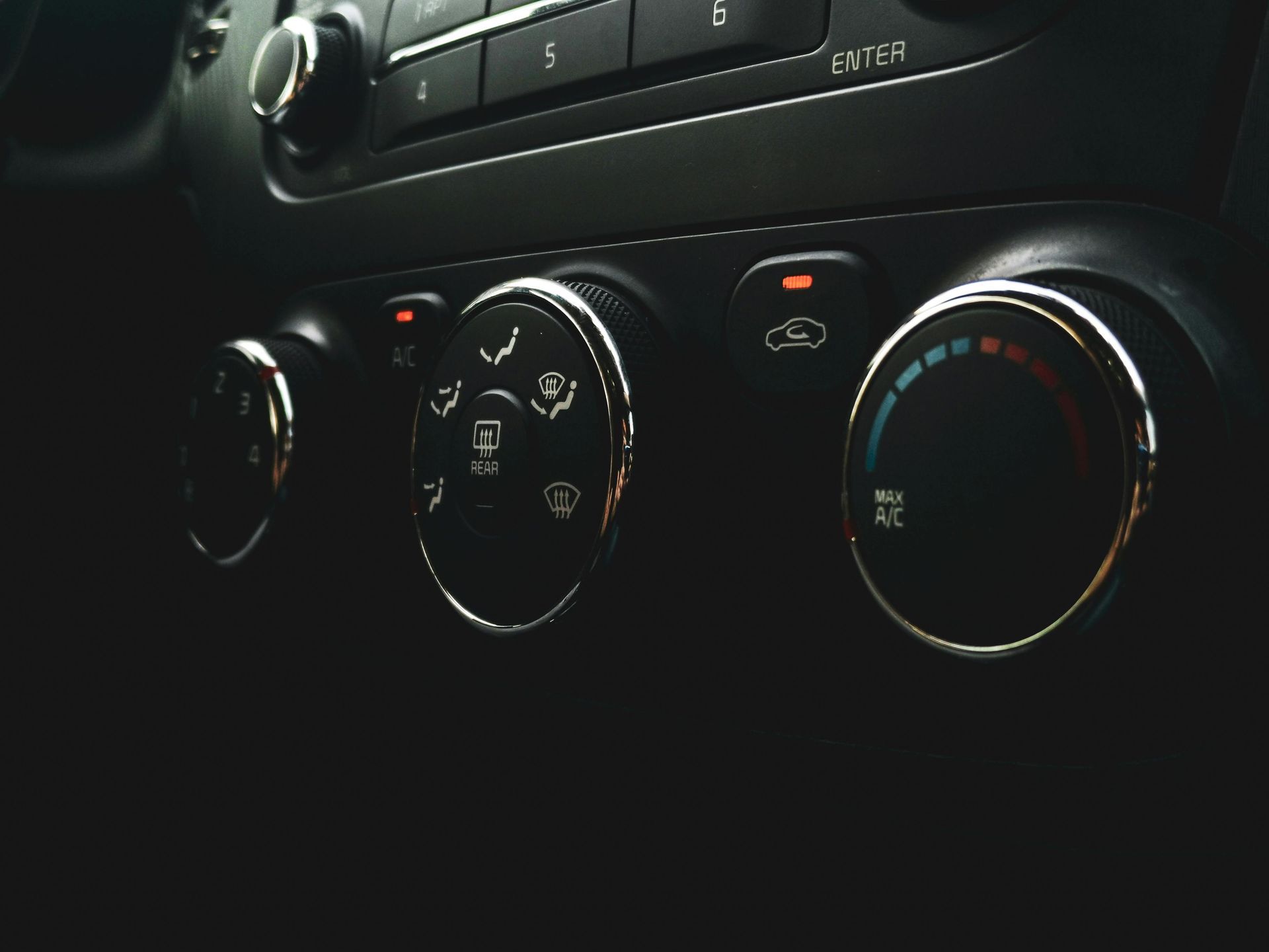 A close up of a car air conditioning control panel