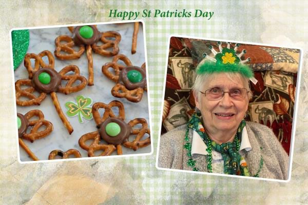 An elderly woman is wearing a green headband and pretzels for st. patrick 's day