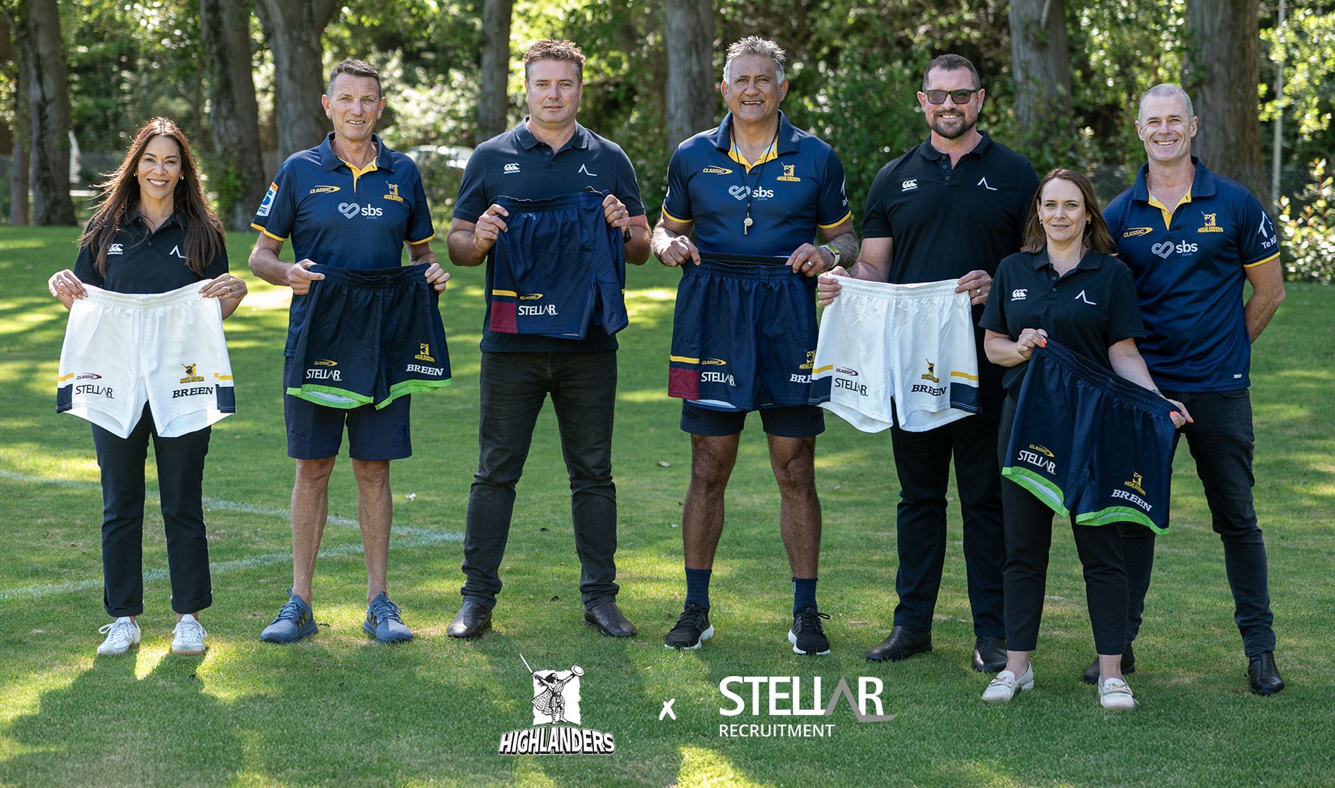 Stellar Recruitment and Highlanders team holding up branded uniform