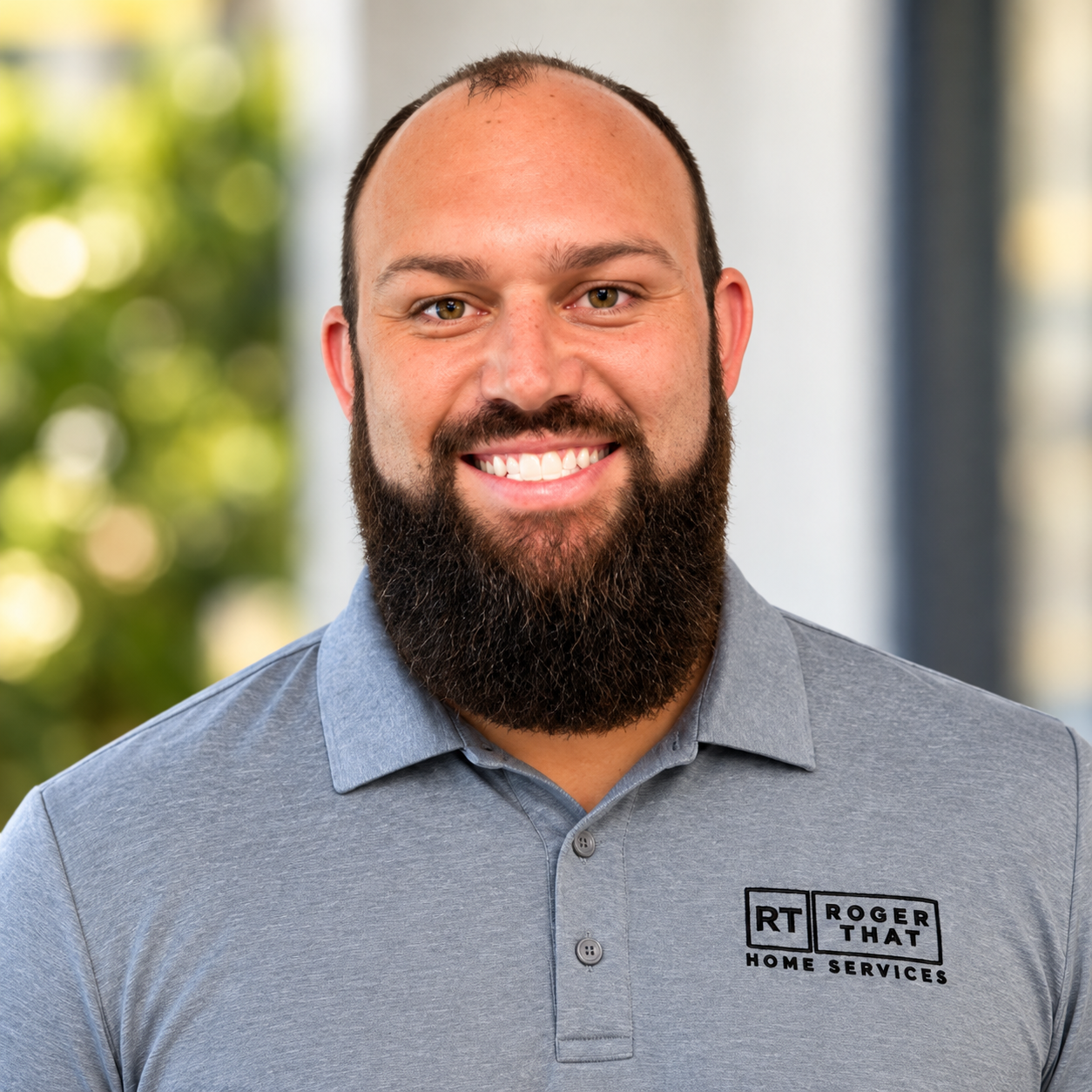 Brandon, owner of Roger That Home Services, smiling headshot