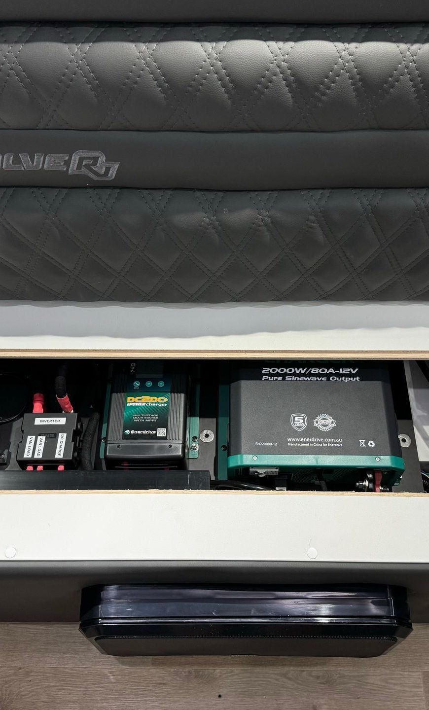 Under-bed caravan power system with Enerdrive inverter and DC charger for reliable off-grid 12V and 240V power.
