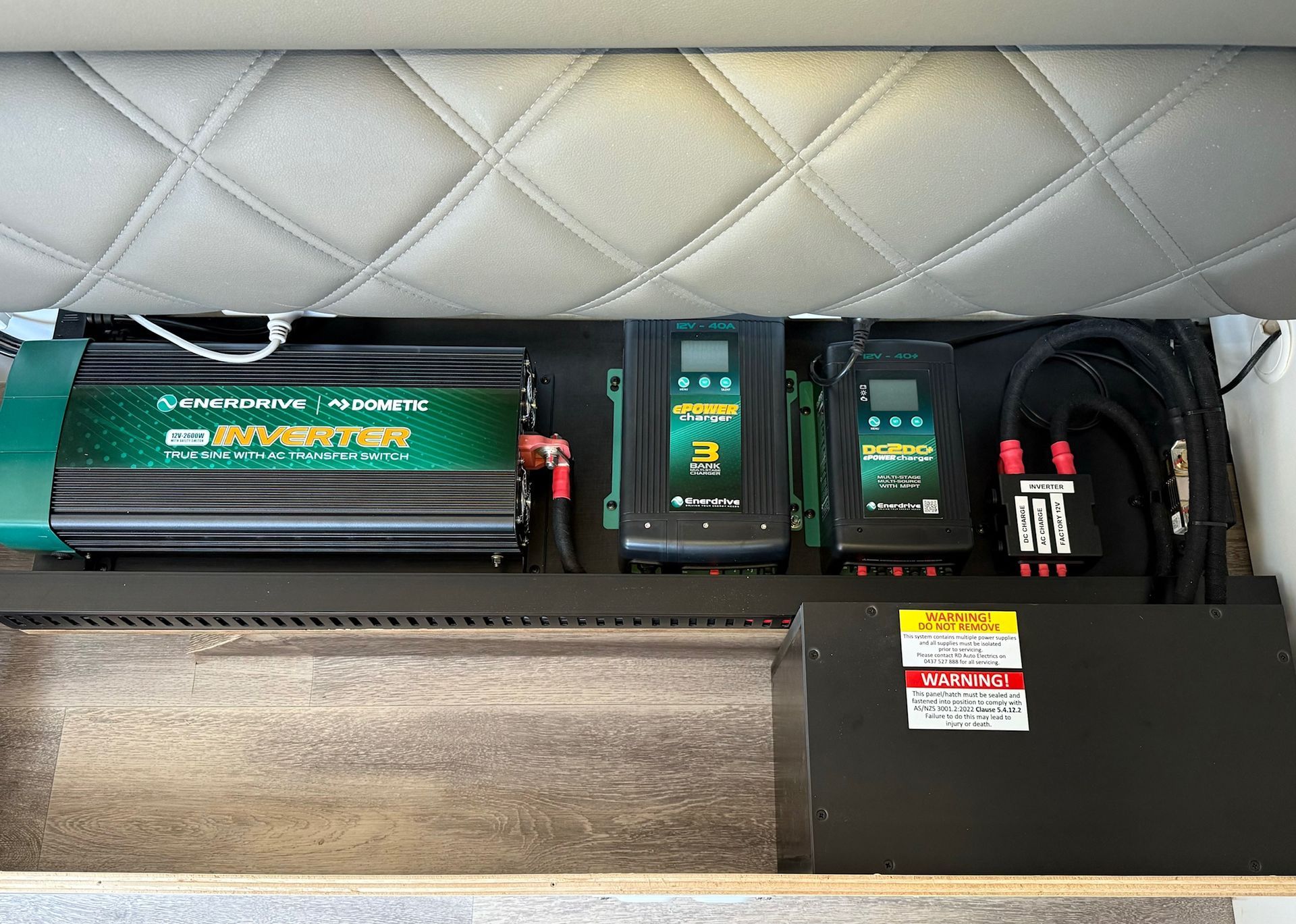 Enerdrive inverter and DC2DC charger system installed in caravan for off-grid 12V and 240V power management.