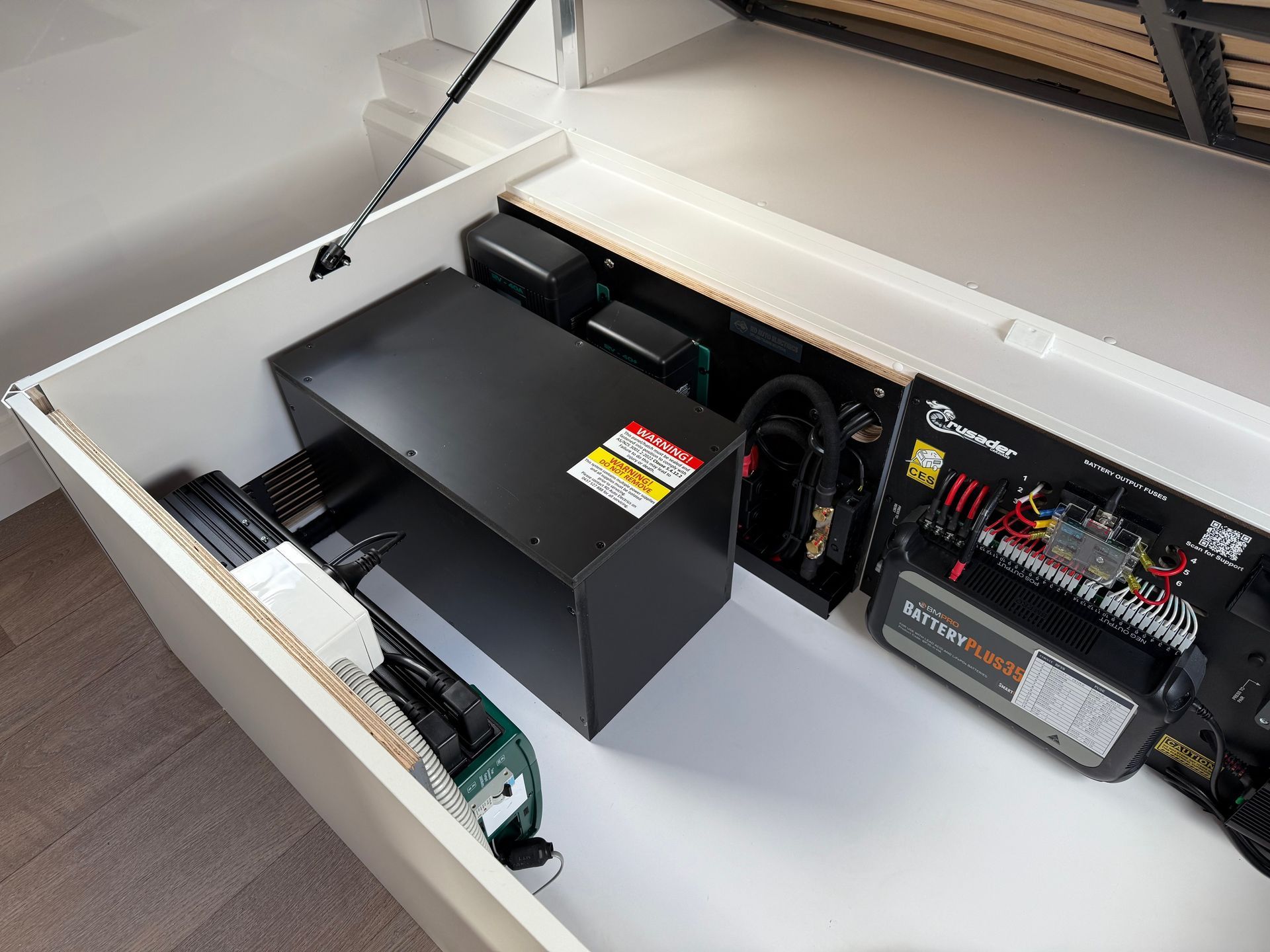Compact RV electrical system featuring inverter, battery management and power distribution for off-grid use.