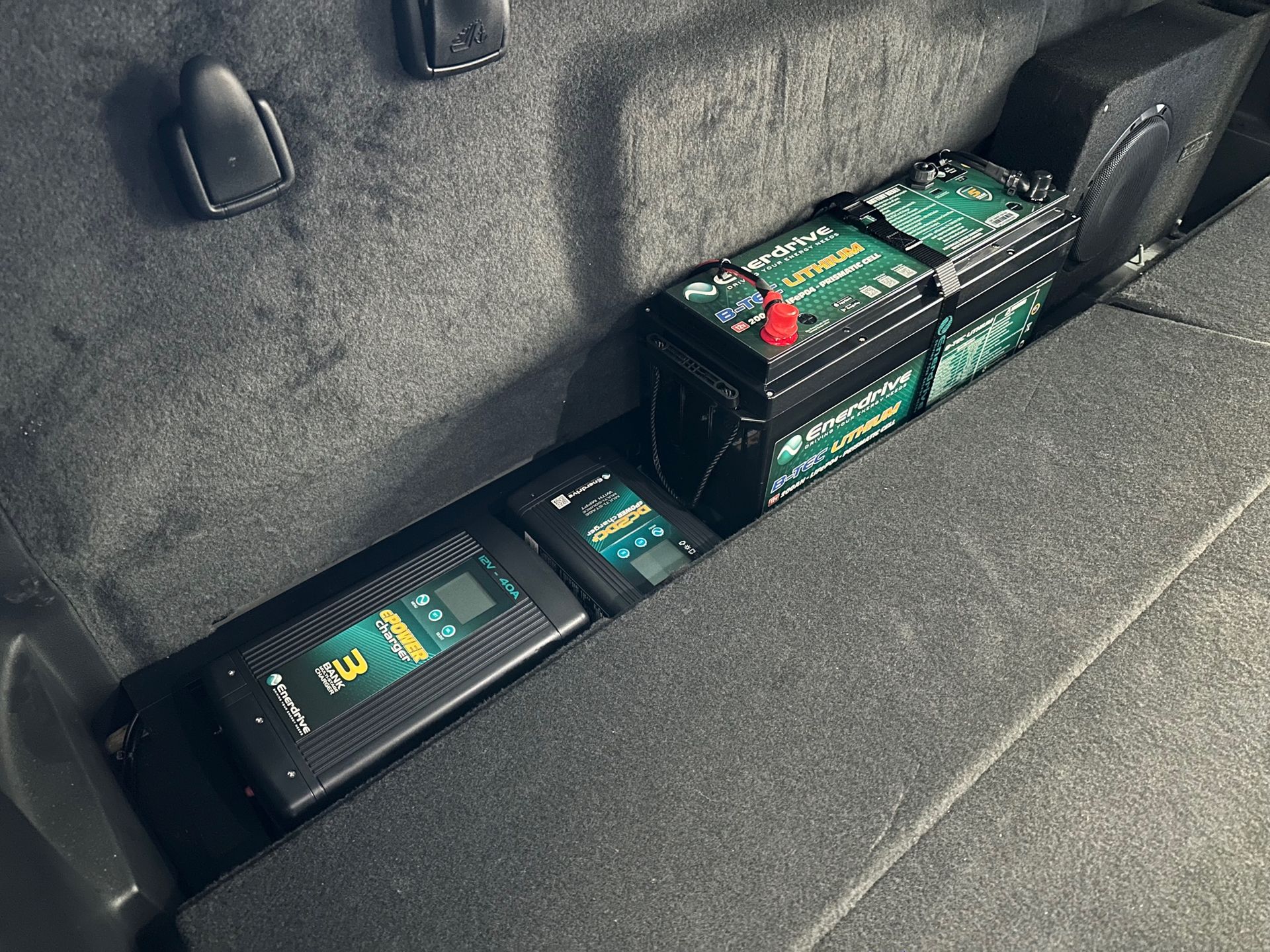 4WD rear cargo power system with lithium battery and DC charger for off-grid travel and camping.