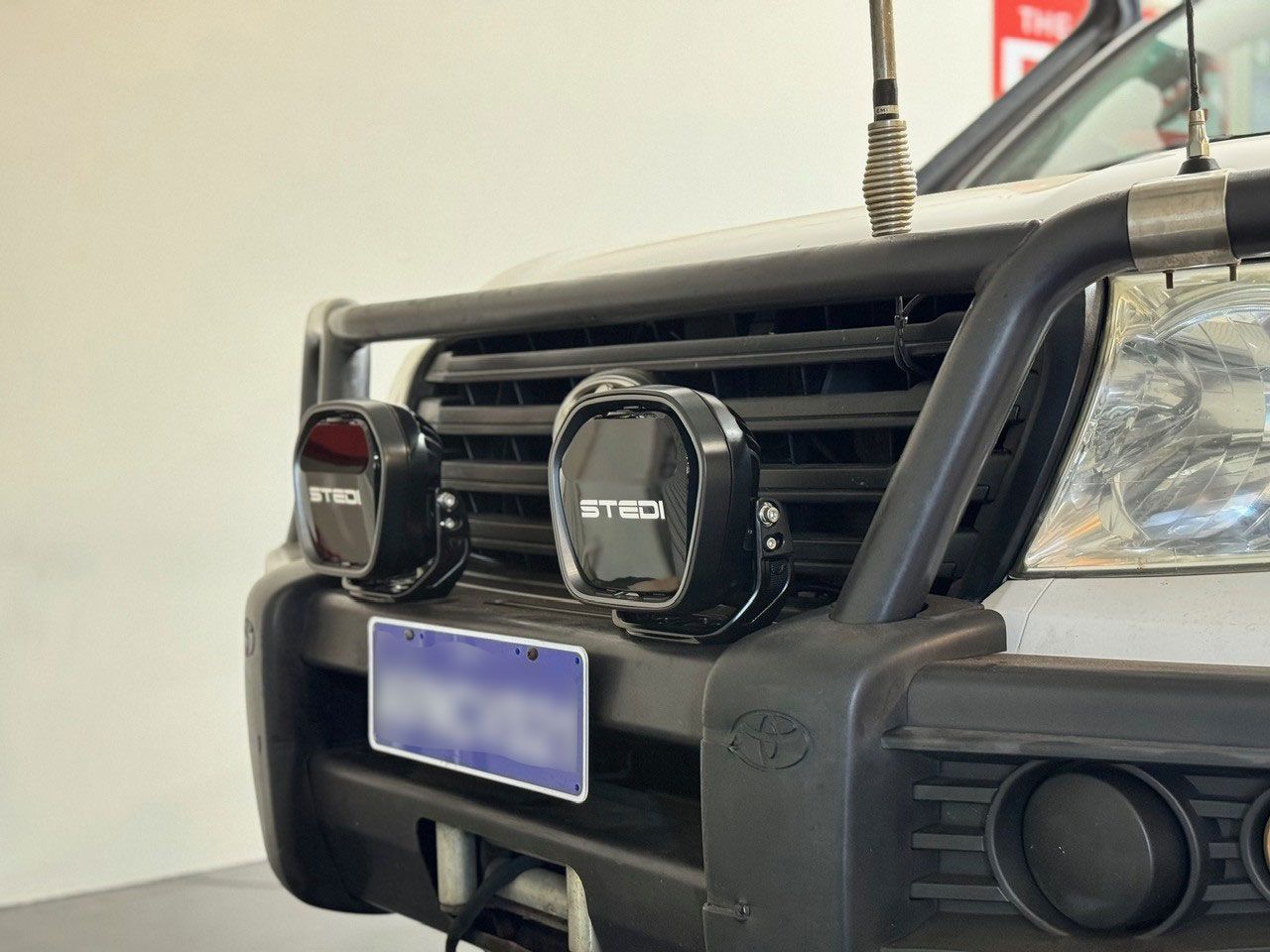 STEDI LED driving lights mounted on bull bar of Toyota 4WD for improved night driving and off-road visibility.