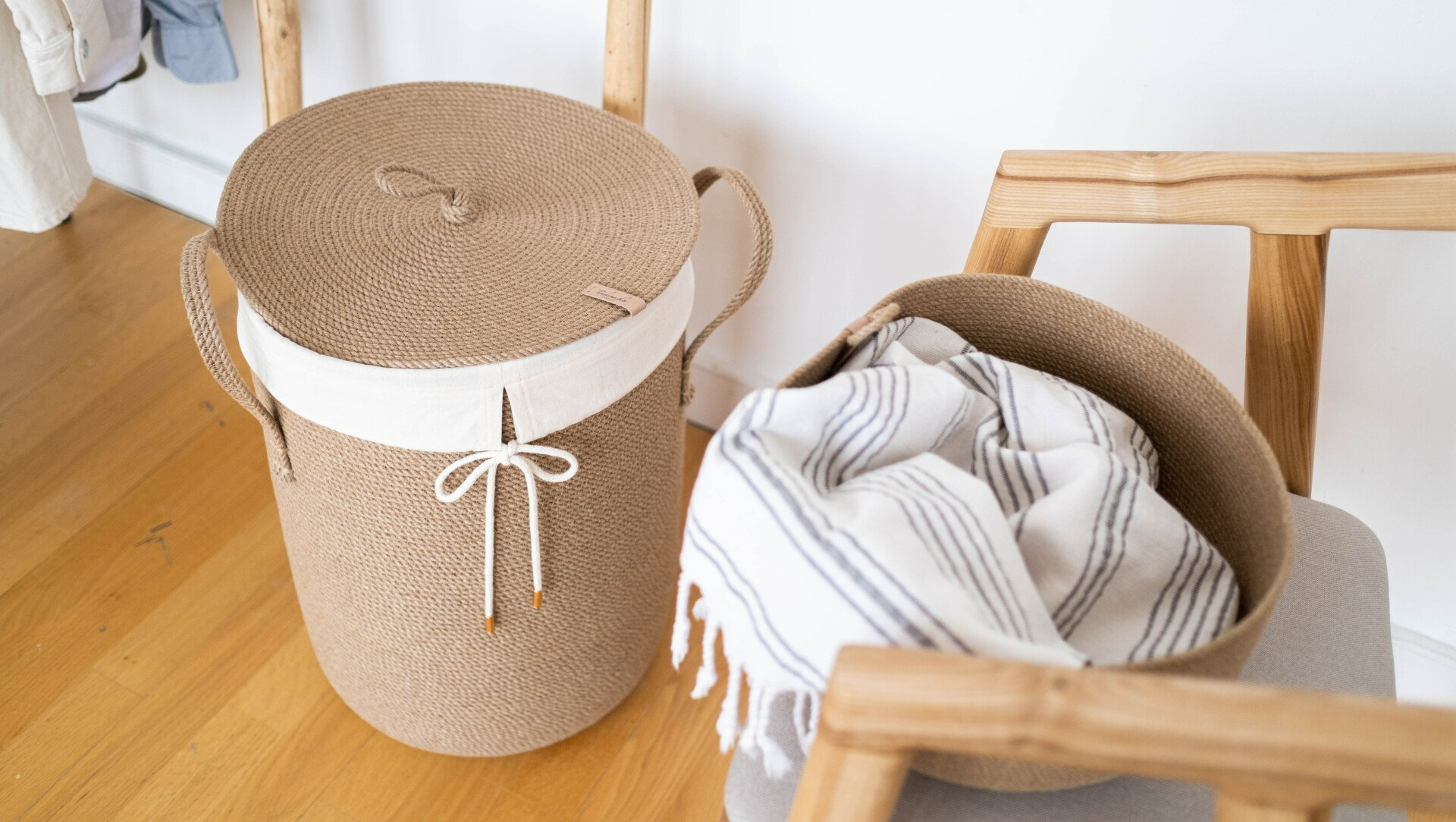 laundry basket with throw falling out of it