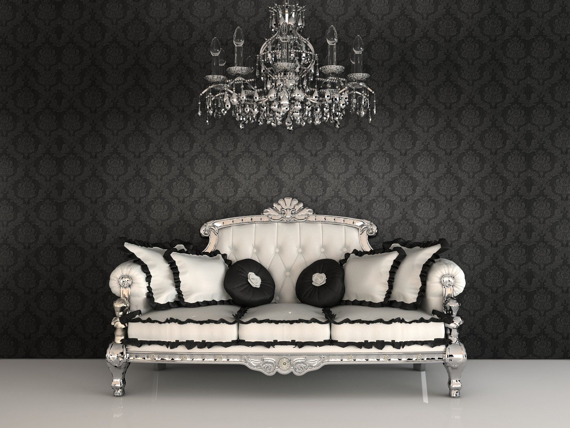 Elegant white and black sofa beneath a crystal chandelier against dark patterned wallpaper