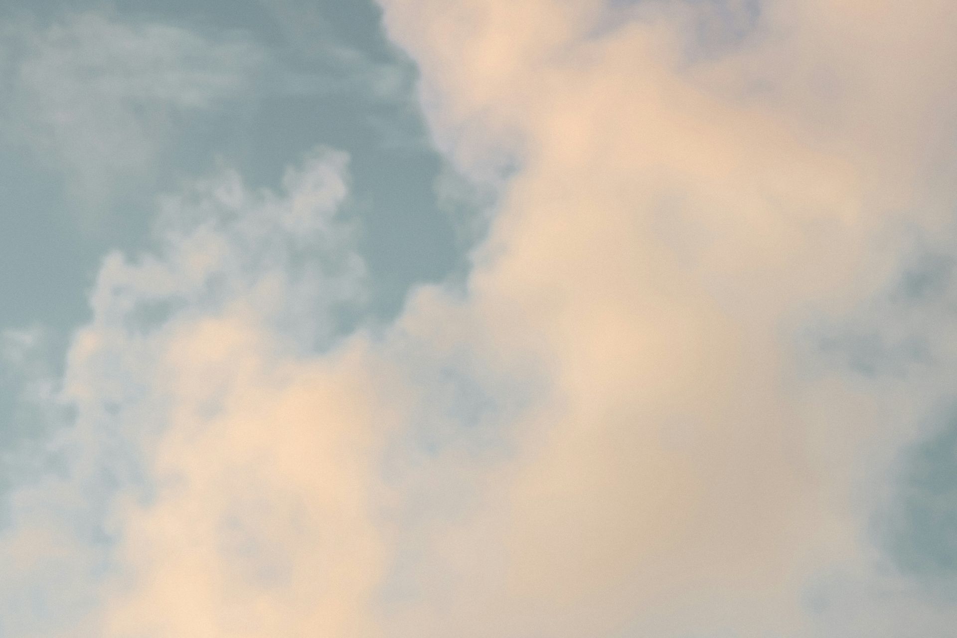 A close up of a cloud in a blue sky