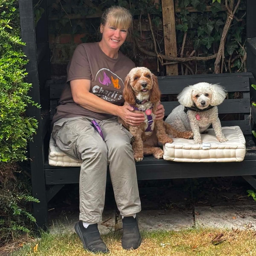 Kate, a member of the Charli's Pet Angels team with a dog
