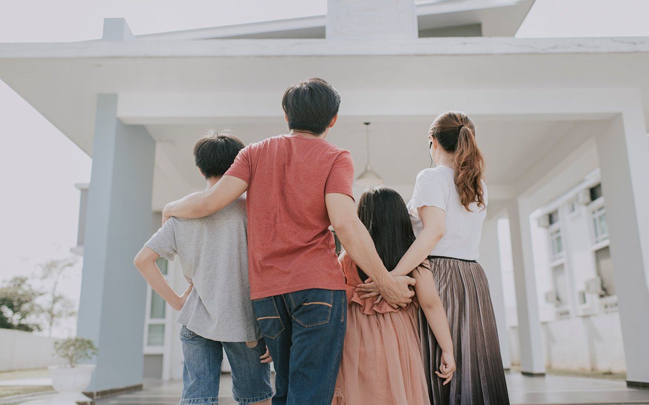 Happy Family In Front Of House — Pleasanton, CA — Acceptance Insurance Services Inc Happy Family In Front Of House — Pleasanton, CA — Acceptance Insurance Services Inc