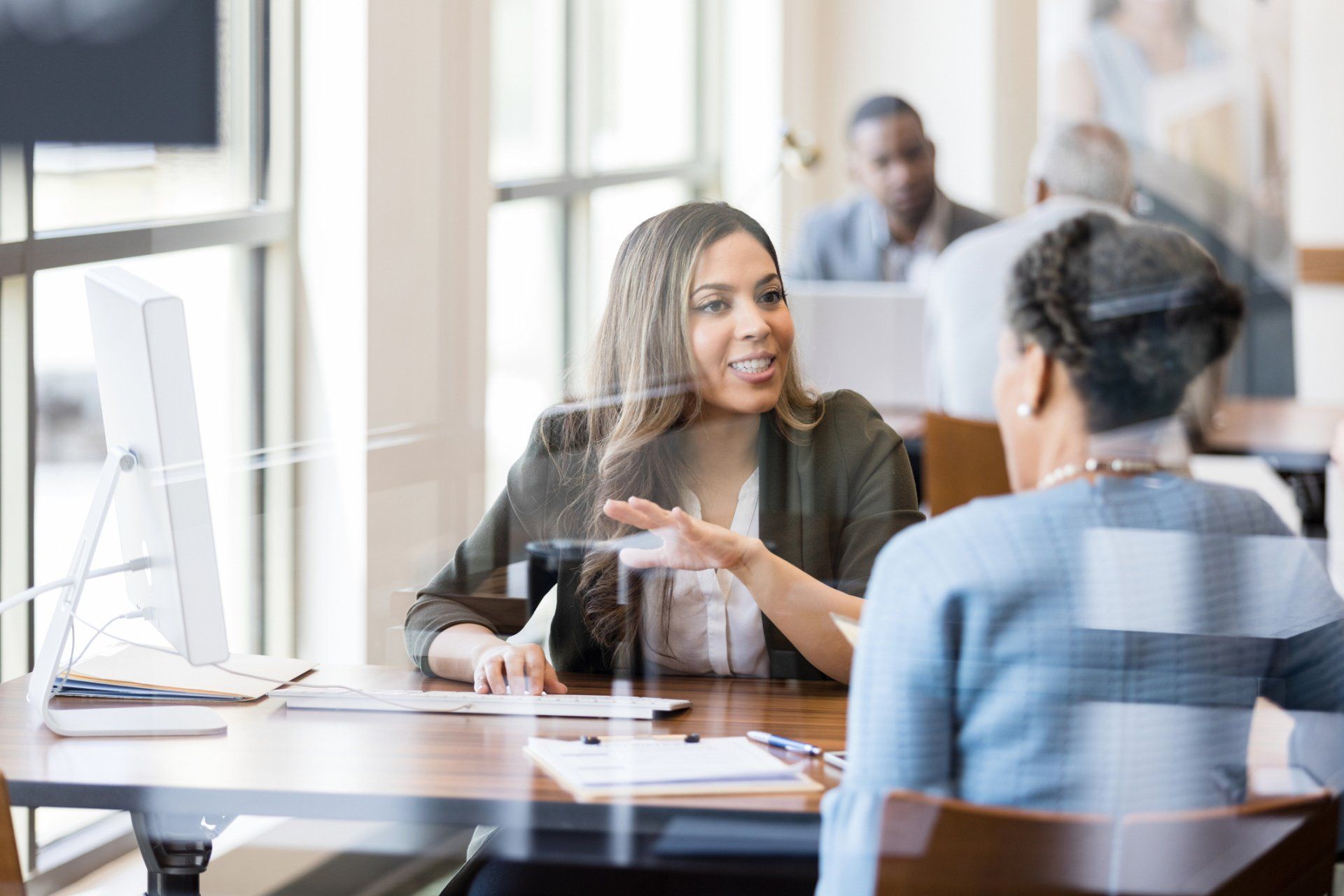 Banker With Client — Pleasanton, CA — Acceptance Insurance Services Inc Banker With Client — Pleasanton, CA — Acceptance Insurance Services Inc