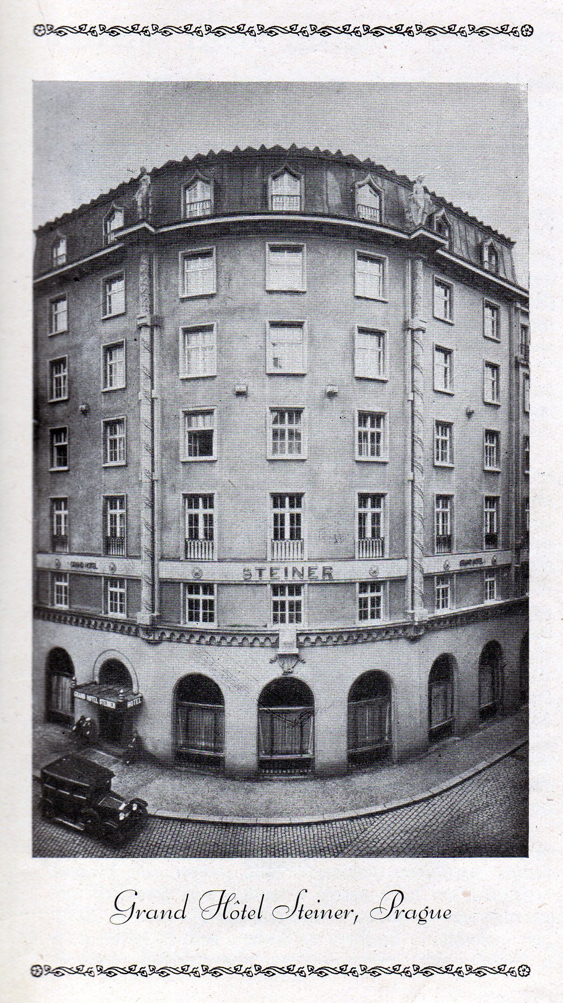 Historic multi-story round building with arched ground-floor openings and many windows on a city street