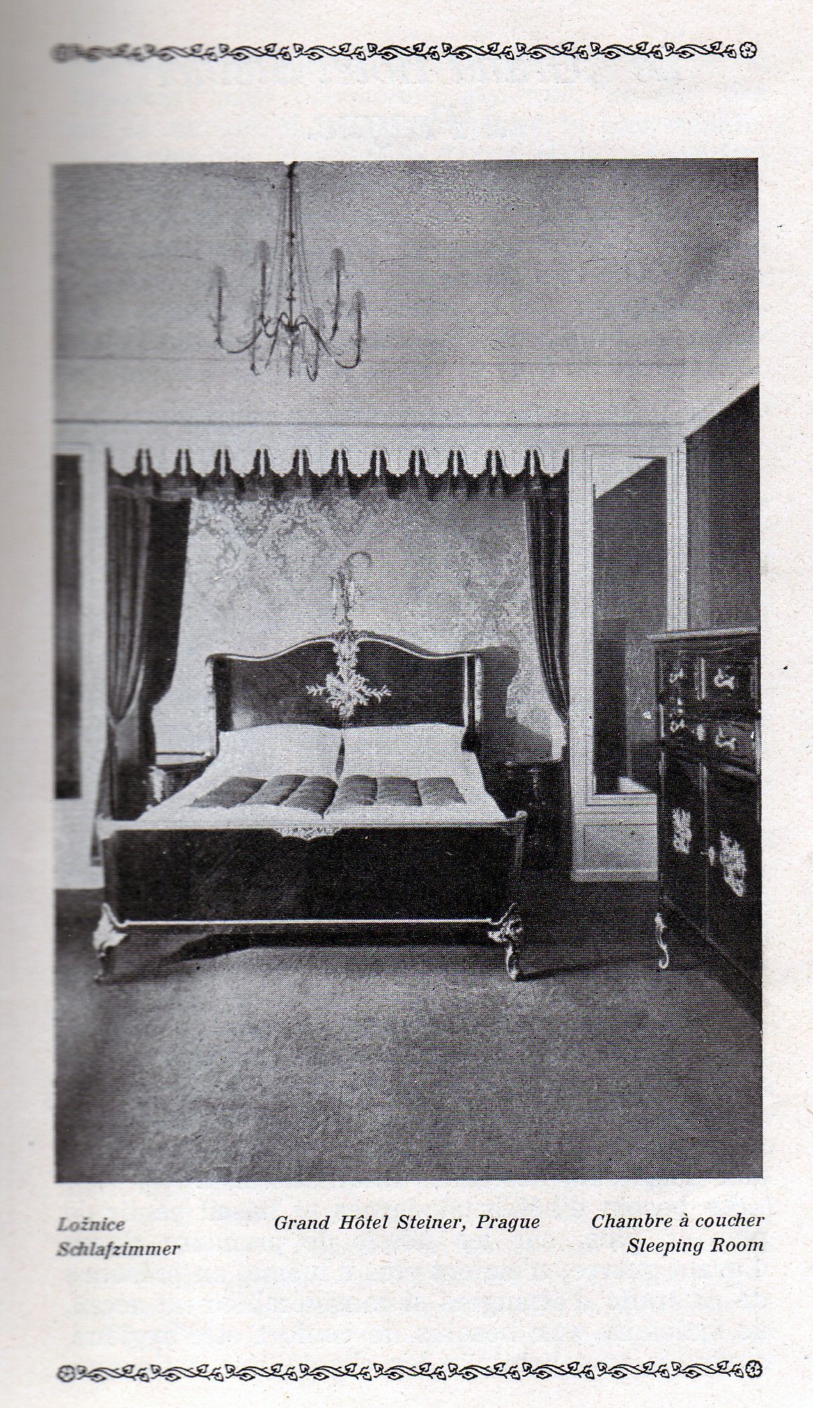 Vintage black-and-white photo of a four-poster bed with draped curtains in an elegant bedroom