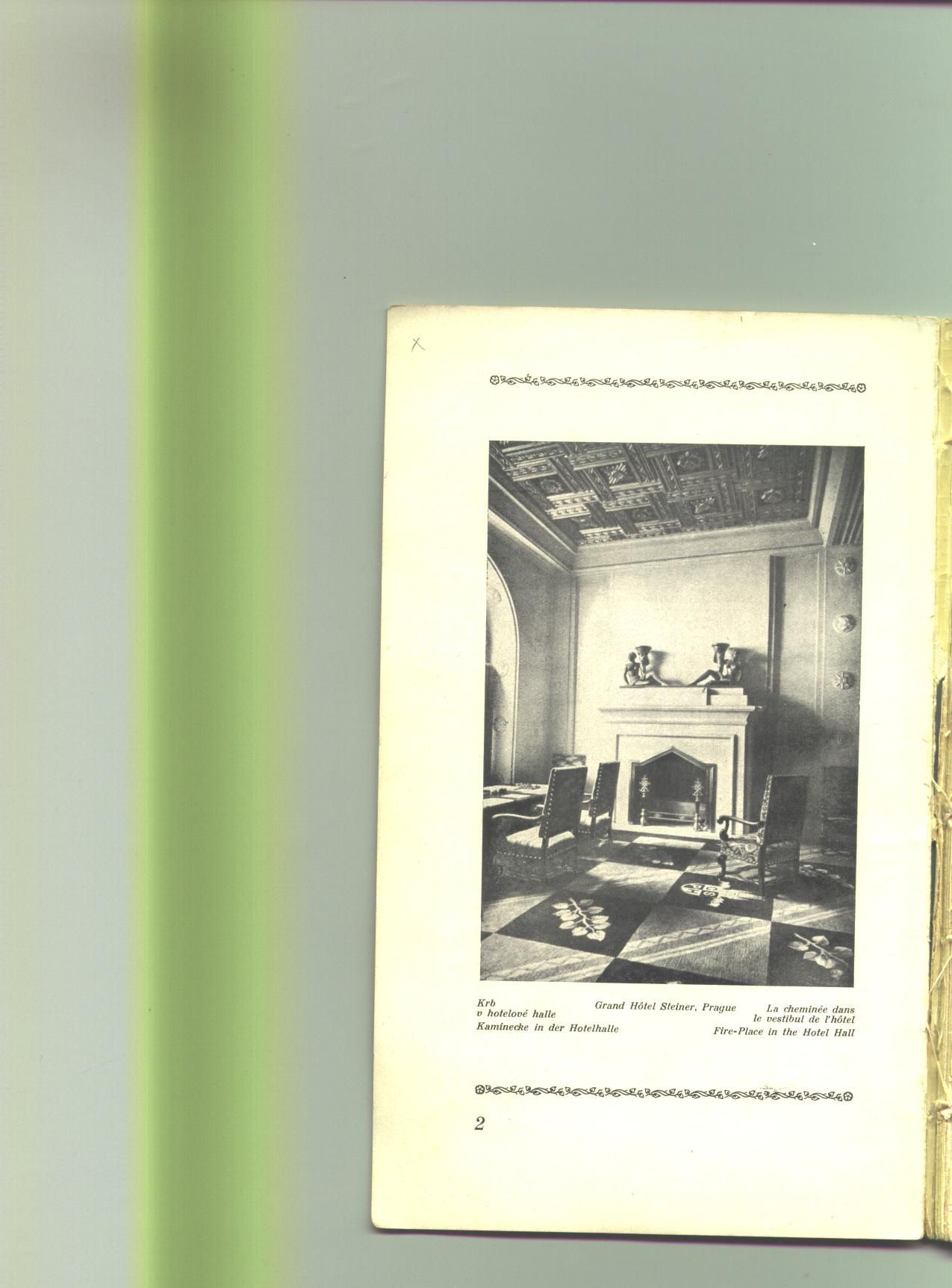 A page showing a black-and-white photo of a room with a fireplace, chairs, and a patterned rug.