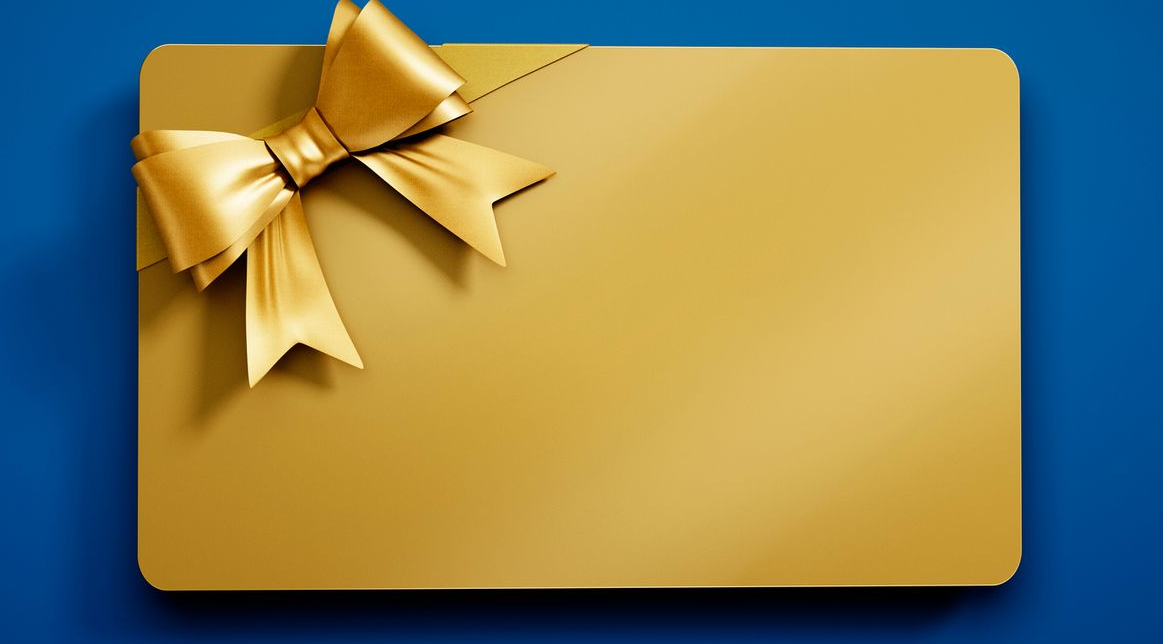 Gold gift card with a bow on a blue background