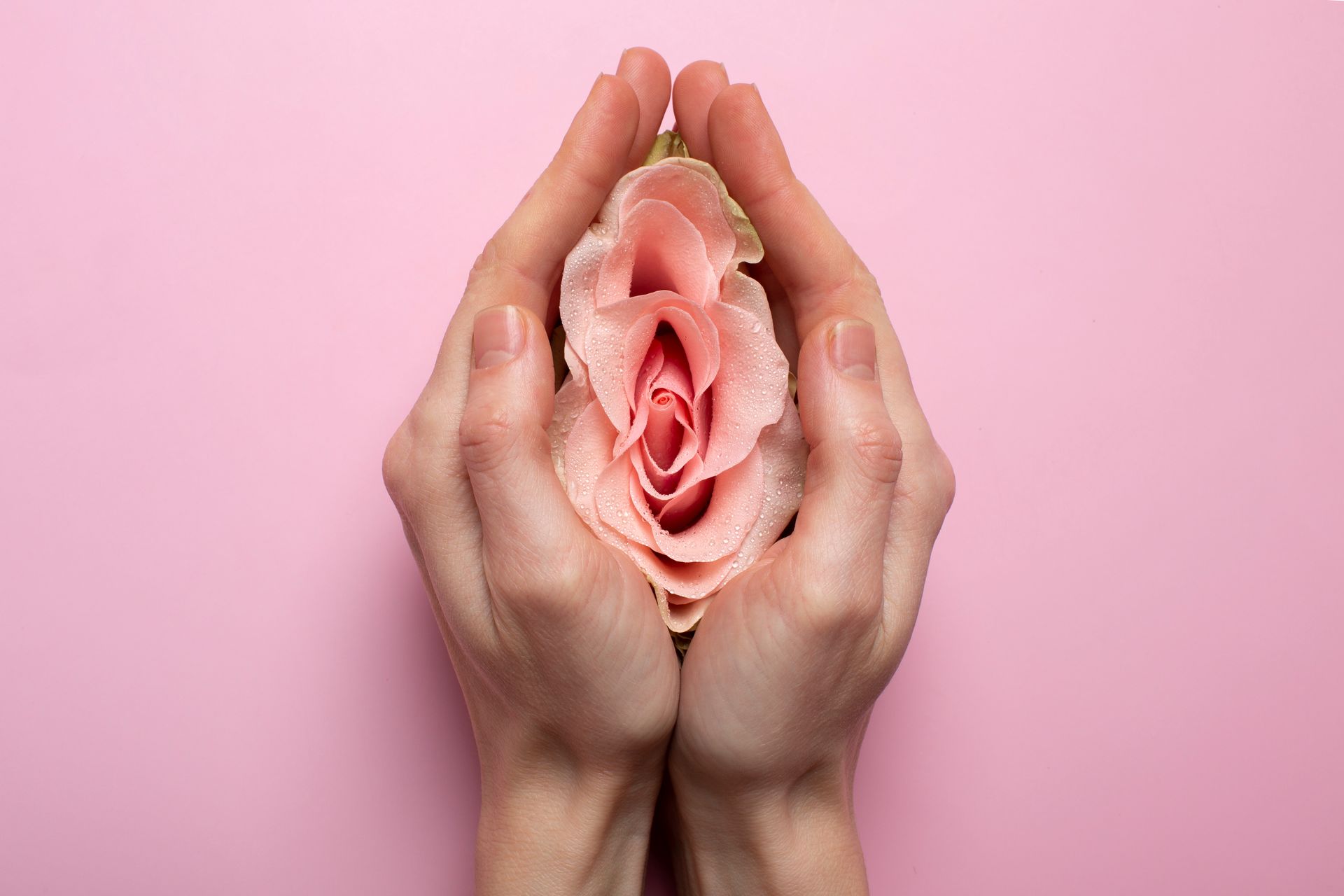 two hands holding a flower at the centre.