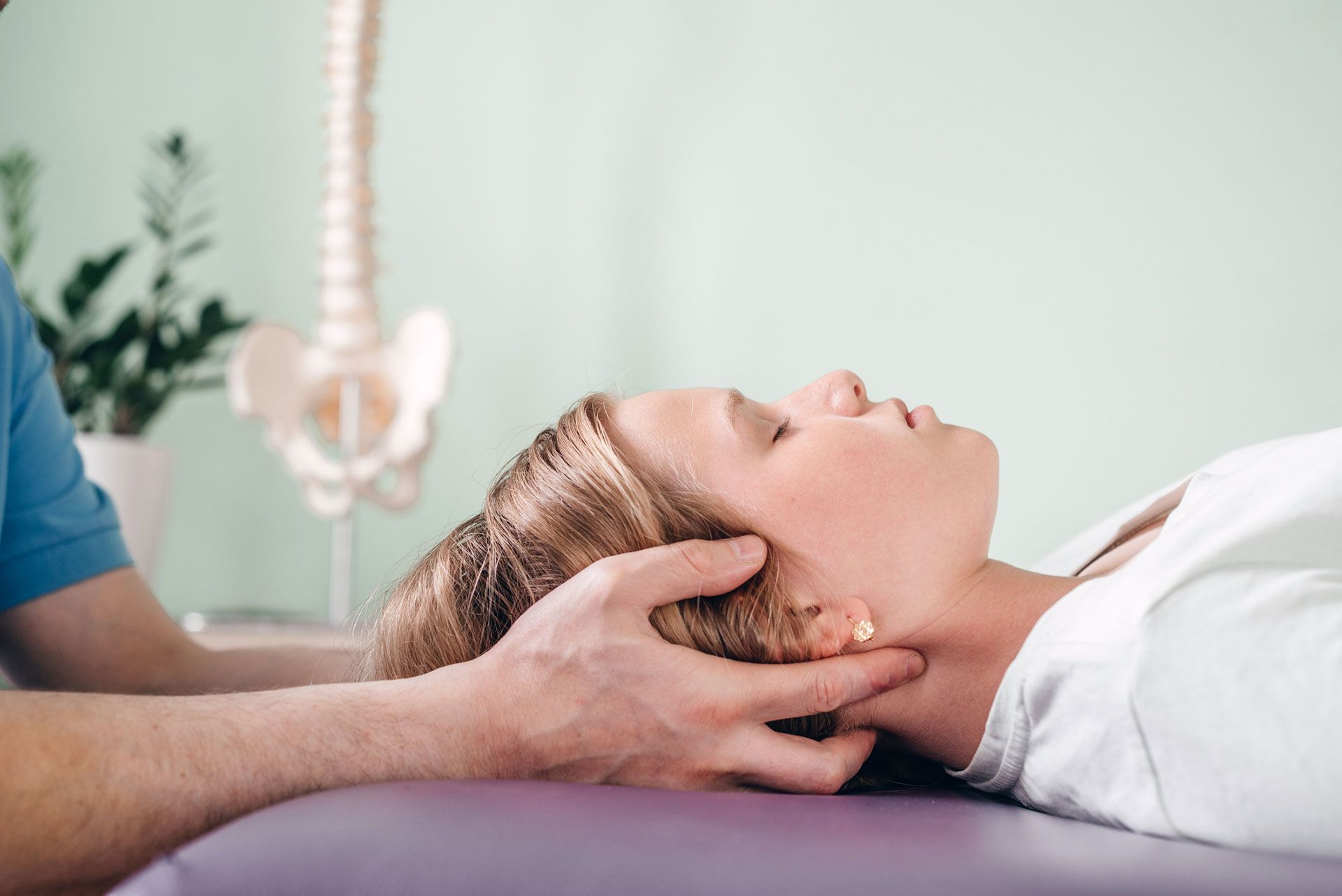 A girl receiving CST treatment. Osteopathic Manipulation and CranioSacral Therapy for children and a