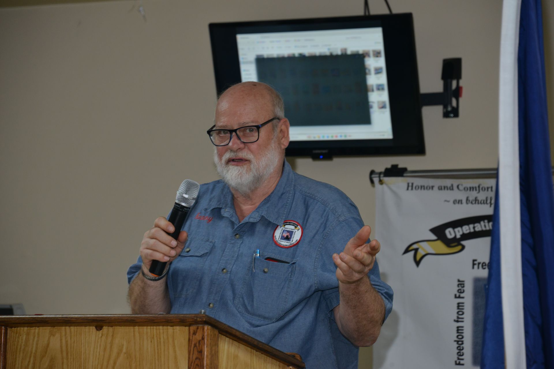 Board President Ken Houin addressing the crowd