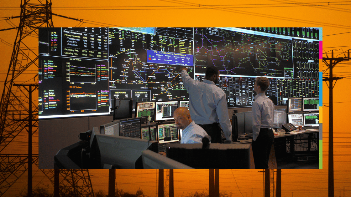 Control room with people monitoring screens, a large display, and power lines in the background.