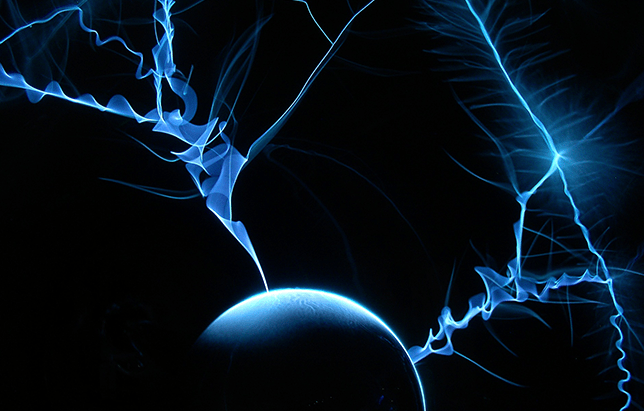Blue electrical arcs radiate from a spherical shape against a dark background.