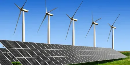 Vast solar panel farm under a clear blue sky, generating renewable energy in an open field.