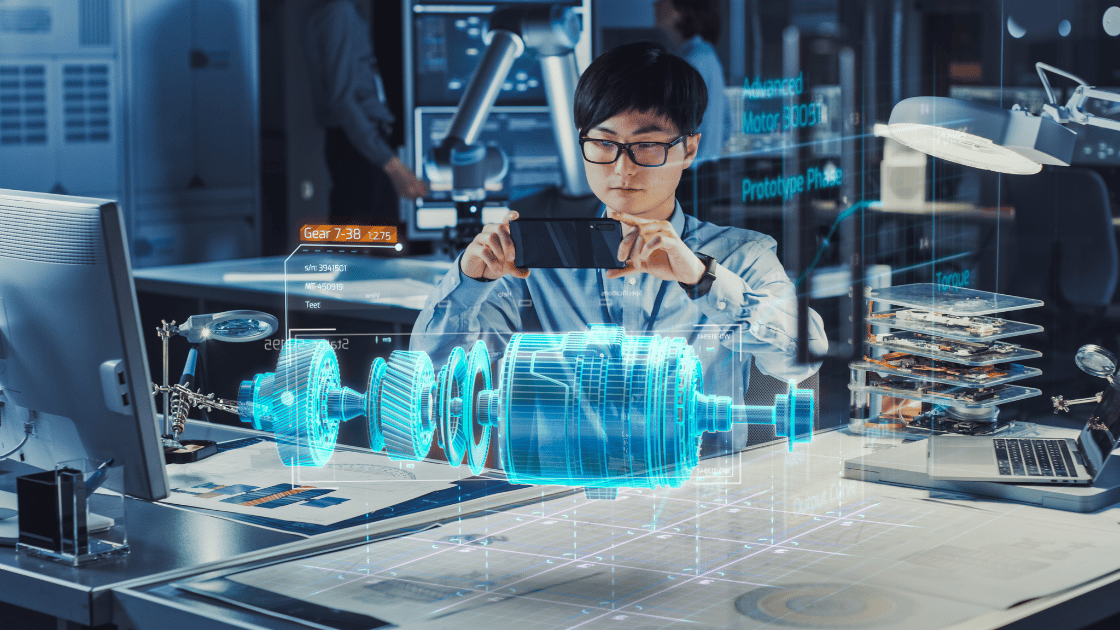 A person examining a holographic engine model with a phone in a laboratory setting.