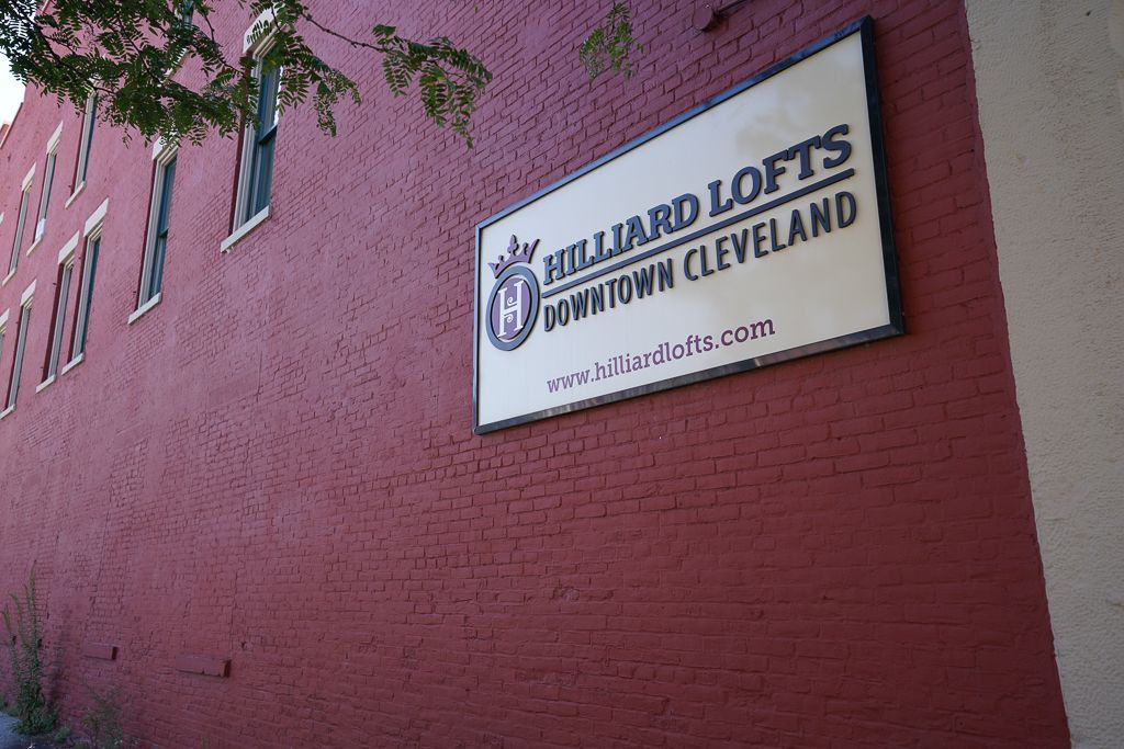 Sign for “The Hillard Lofts” on a red brick building in Cleveland, Ohio