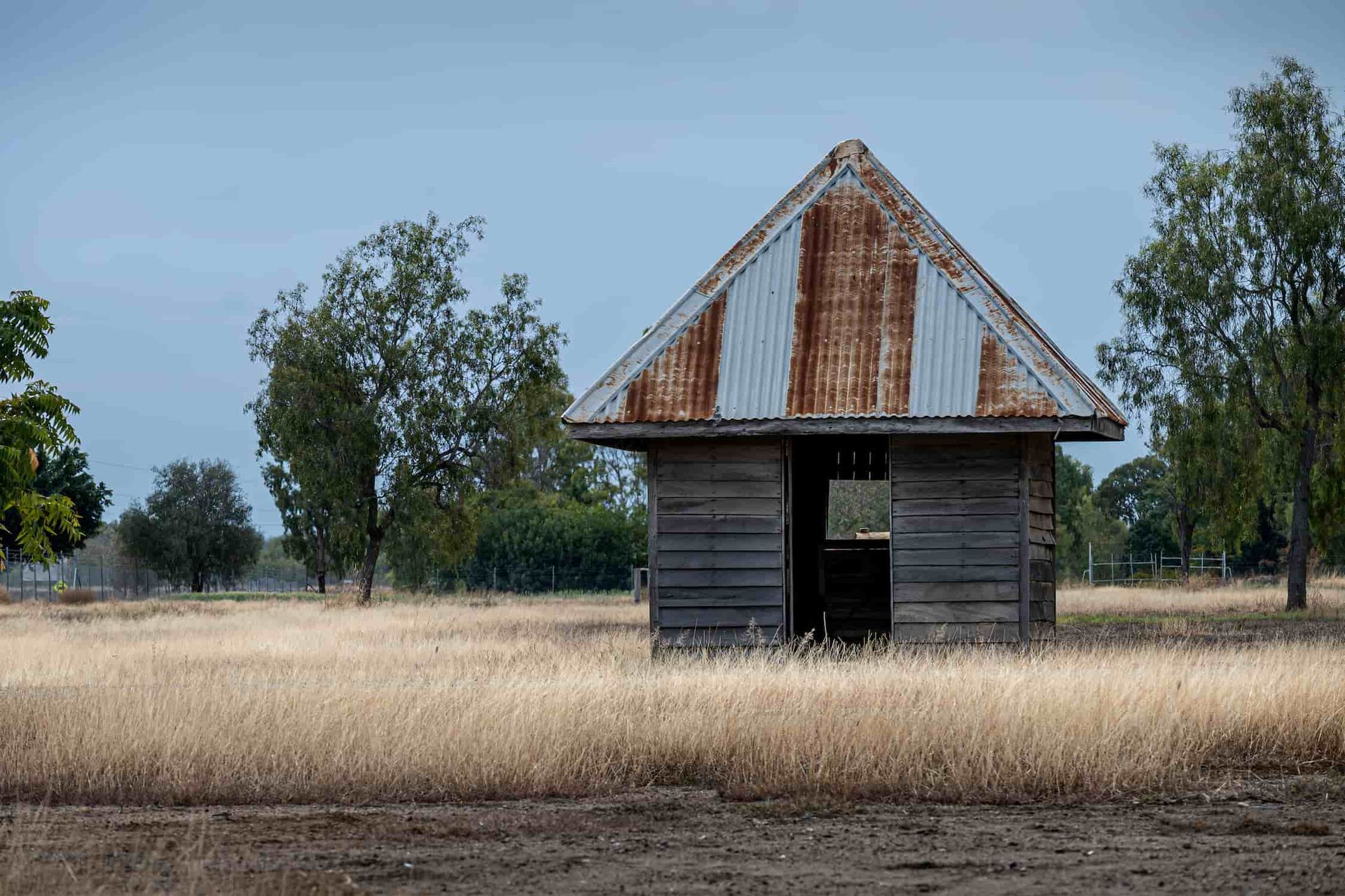 An Old Wooden House With A Rusty Tin Roof — CQ Service Locating In Biloela, QLD