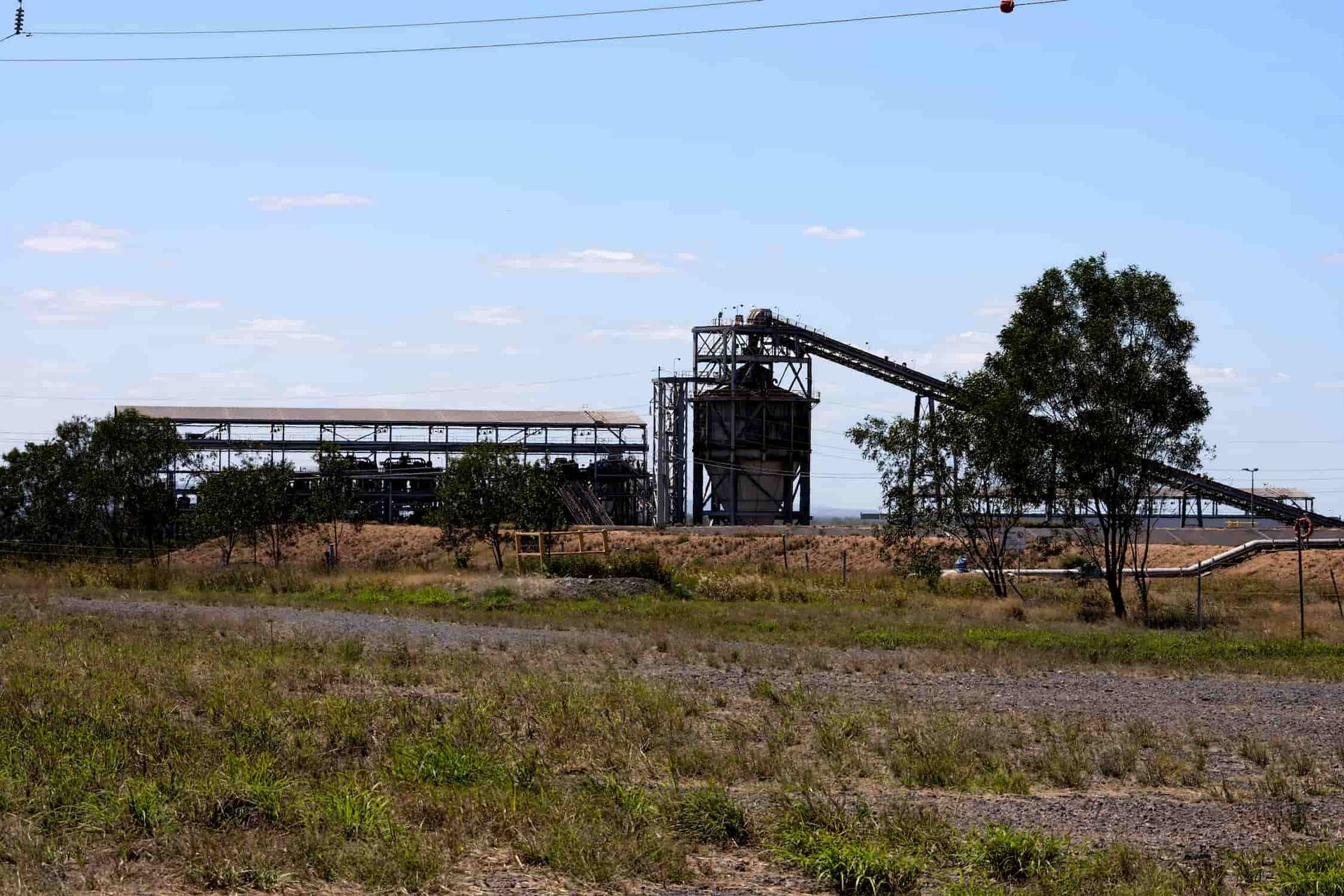 A Large Building In The Middle Of A Field — CQ Service Locating In Moranbah, QLD