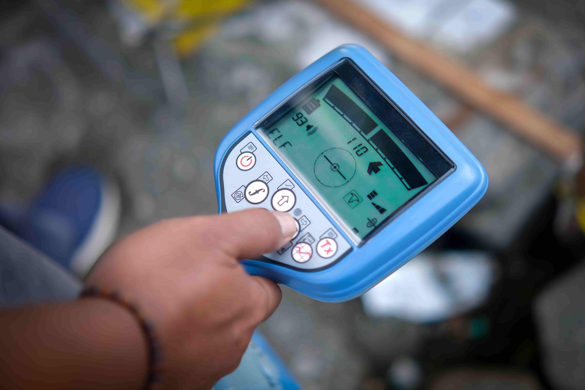A Person Is Holding A Cable And Pipe Locator Device — CQ Service Locating In Rockhampton, QLD