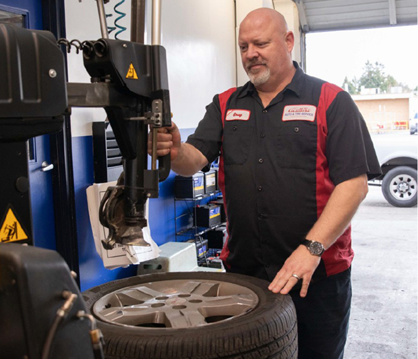 Technician performing tire repairs in Seattle, WA | Masters Auto & Tire