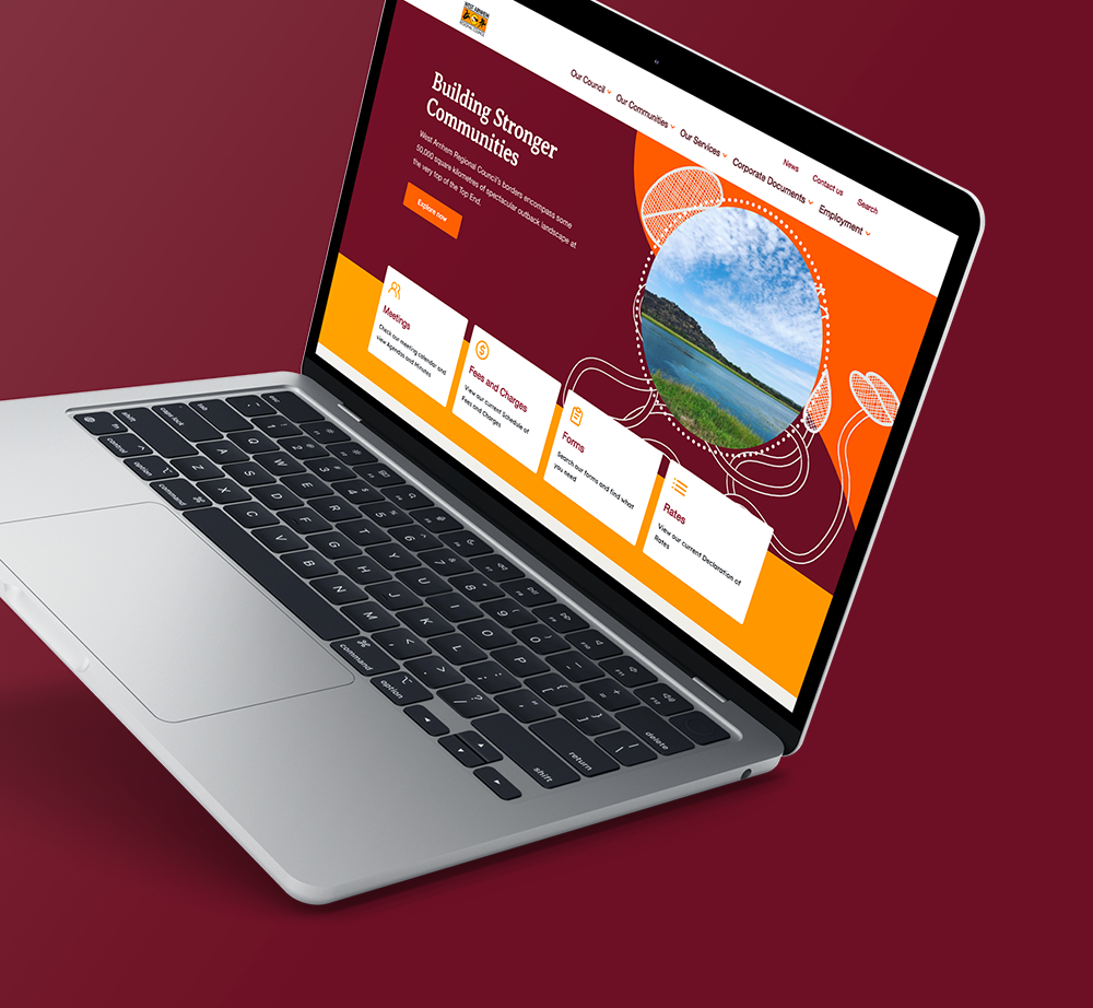 A laptop computer is open to a website on a red background