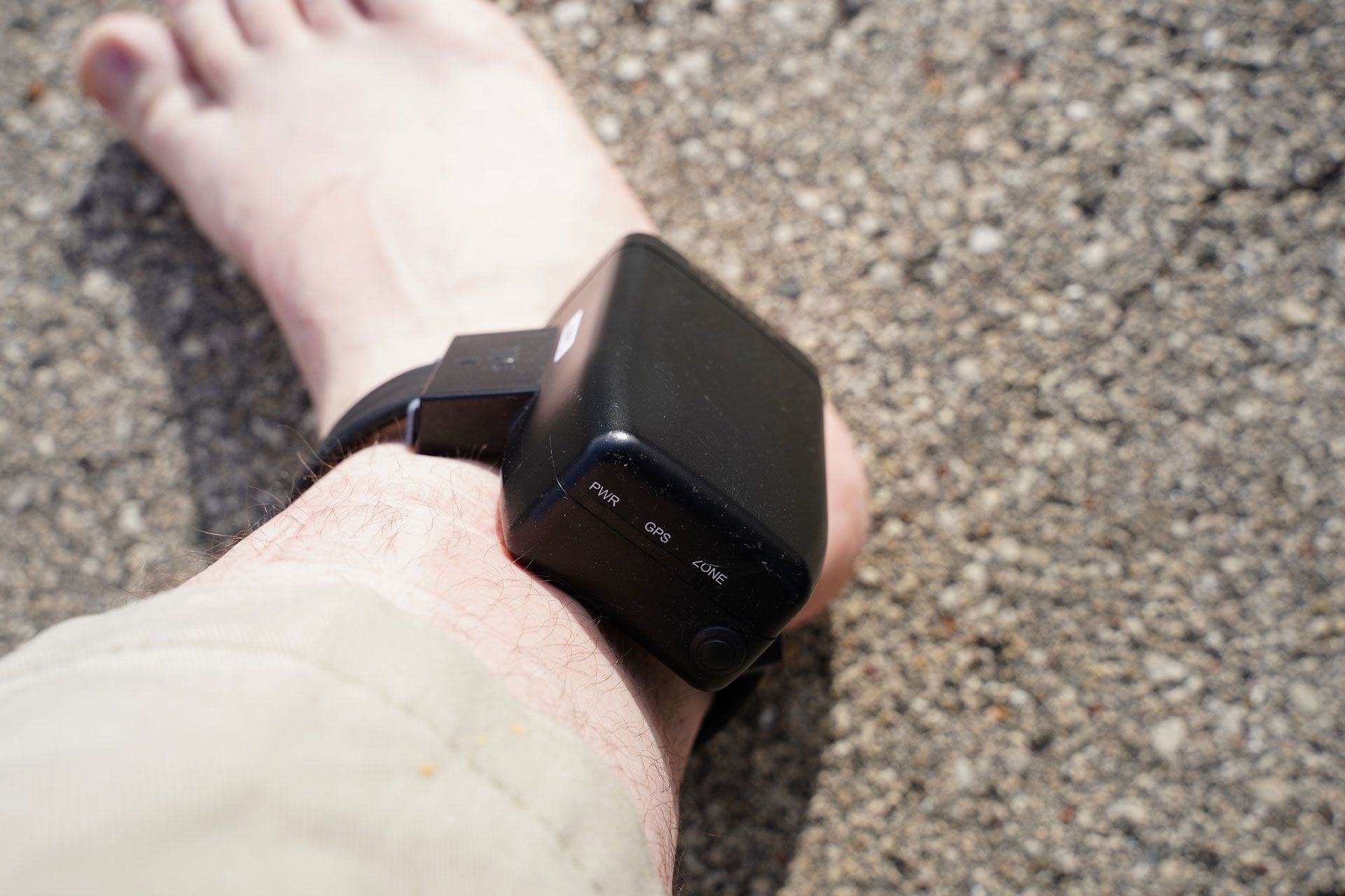 A person is wearing a GPS Monitoring 