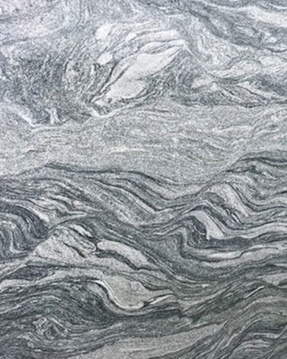 Gray and white marbled stone texture with swirling layered patterns