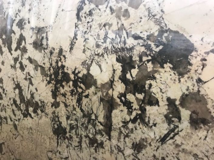 Abstract black-and-white textured pattern resembling paint or rock surface