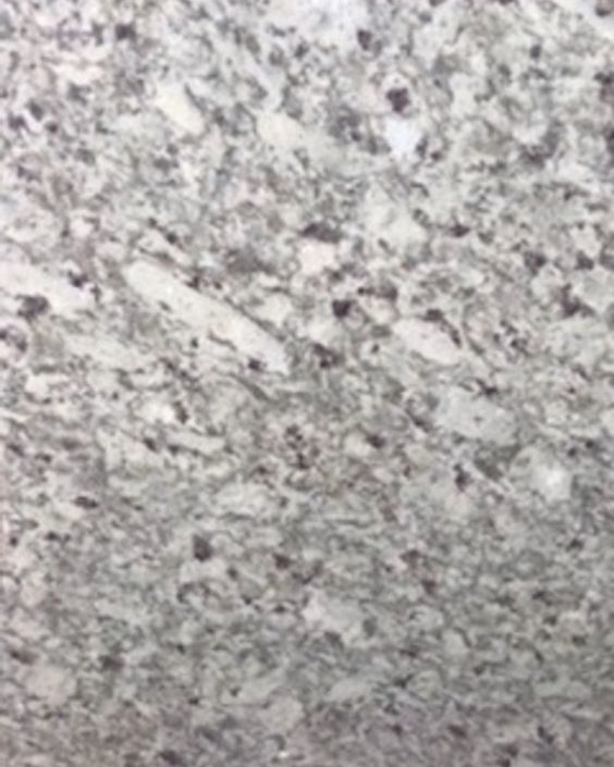 Close-up of a speckled gray granite surface with black and white flecks