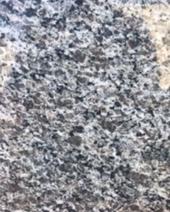Close-up of a gray and black speckled granite surface