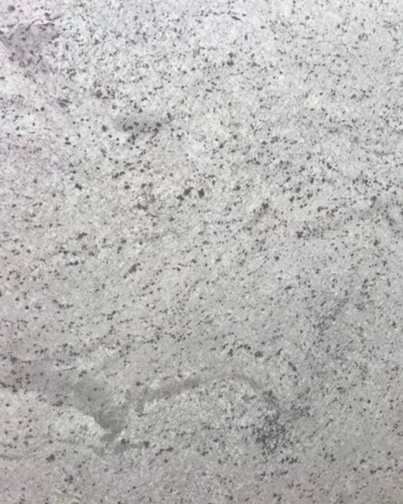 Light gray speckled stone surface with a faint dark stain near the bottom