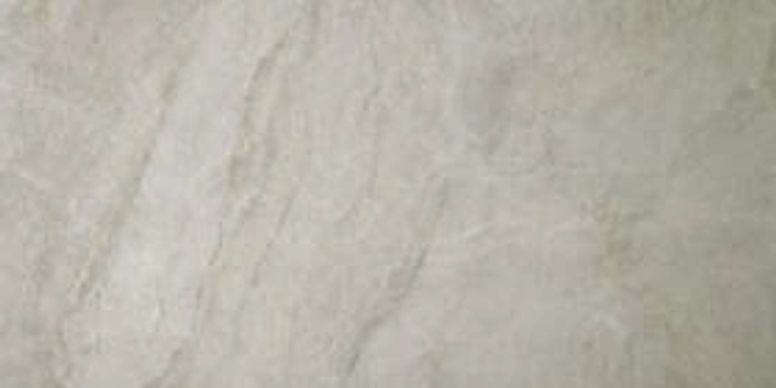 Light beige marble-like textured surface with faint gray veining
