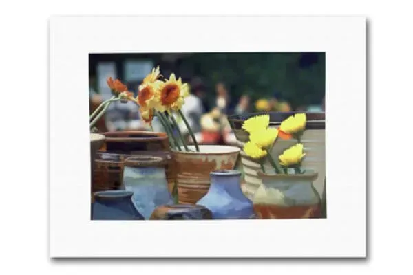 A picture of flowers in vases on a table