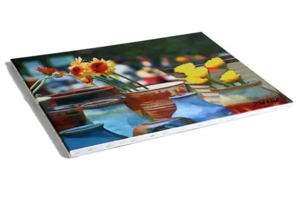 A painting of flowers in a vase on a table