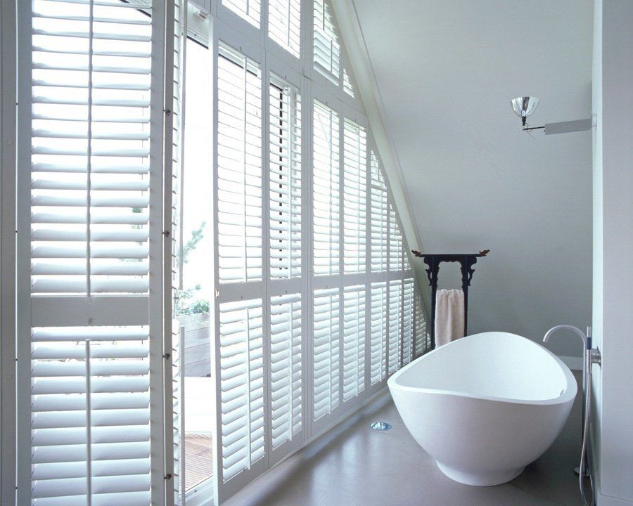 bi-fold shutters in white bathroom
