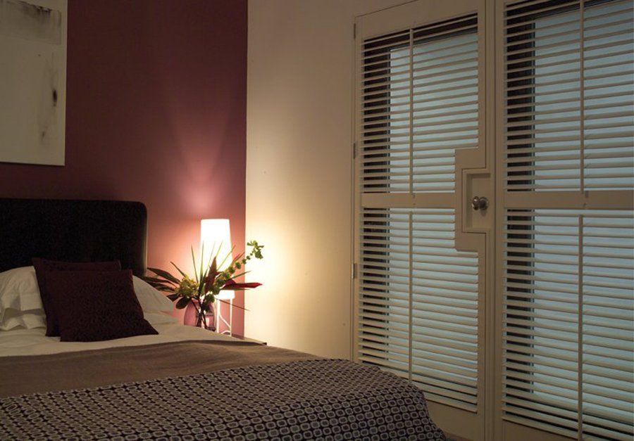 white shutters in bedroom