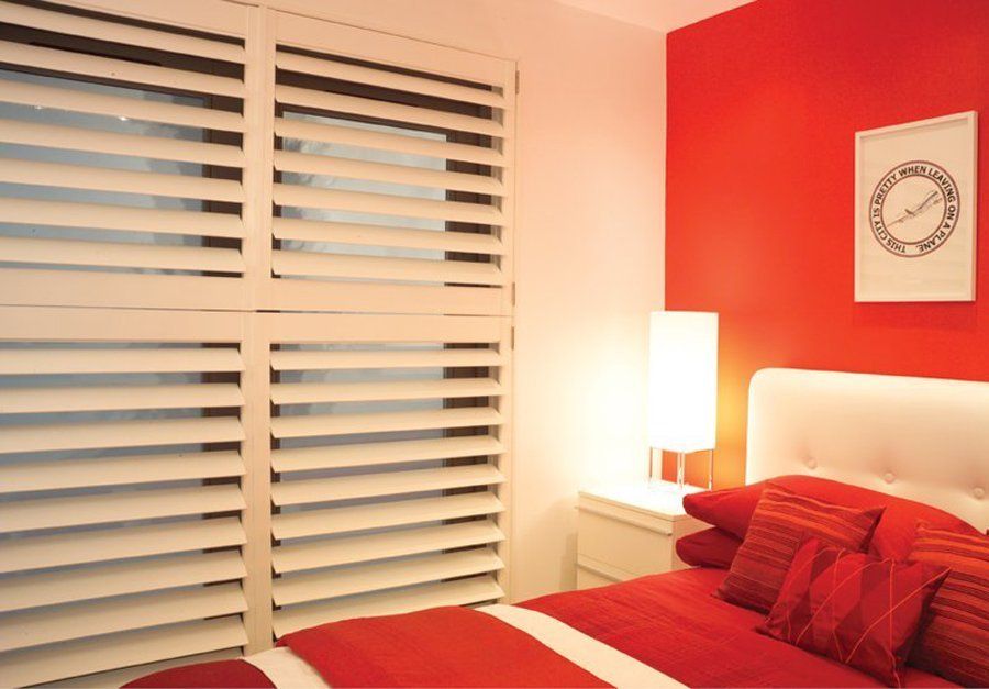 White Wooden shutters in bedroom