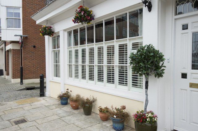 white shutters on cafe windows