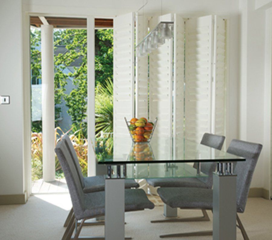 white bi-fold shutters in dining room