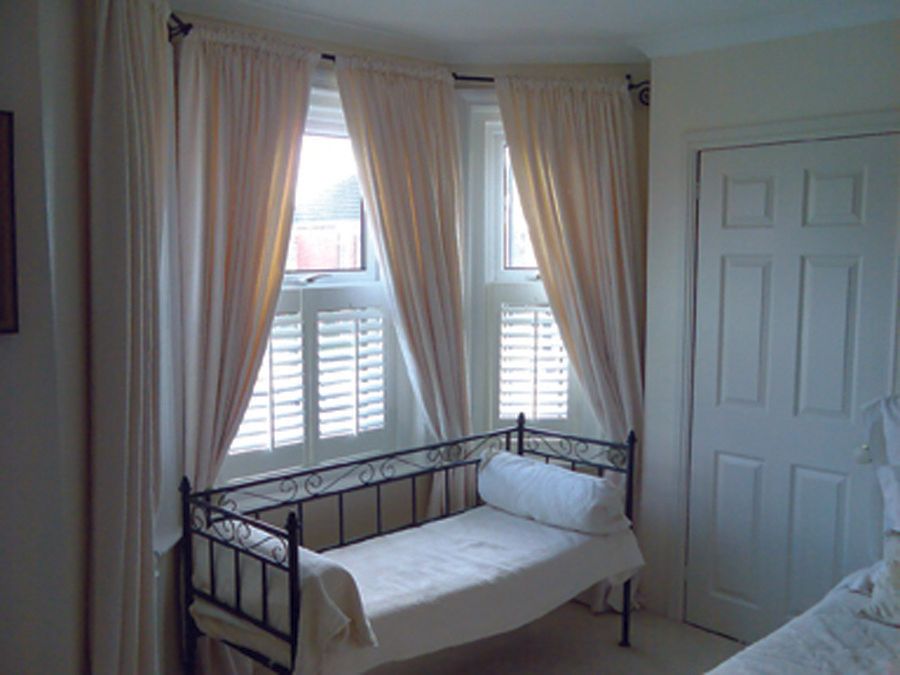 cafe style shutters in bedroom