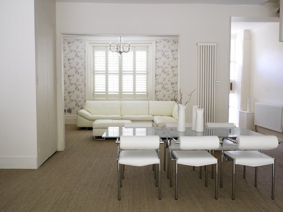 white living dining room with white shutters