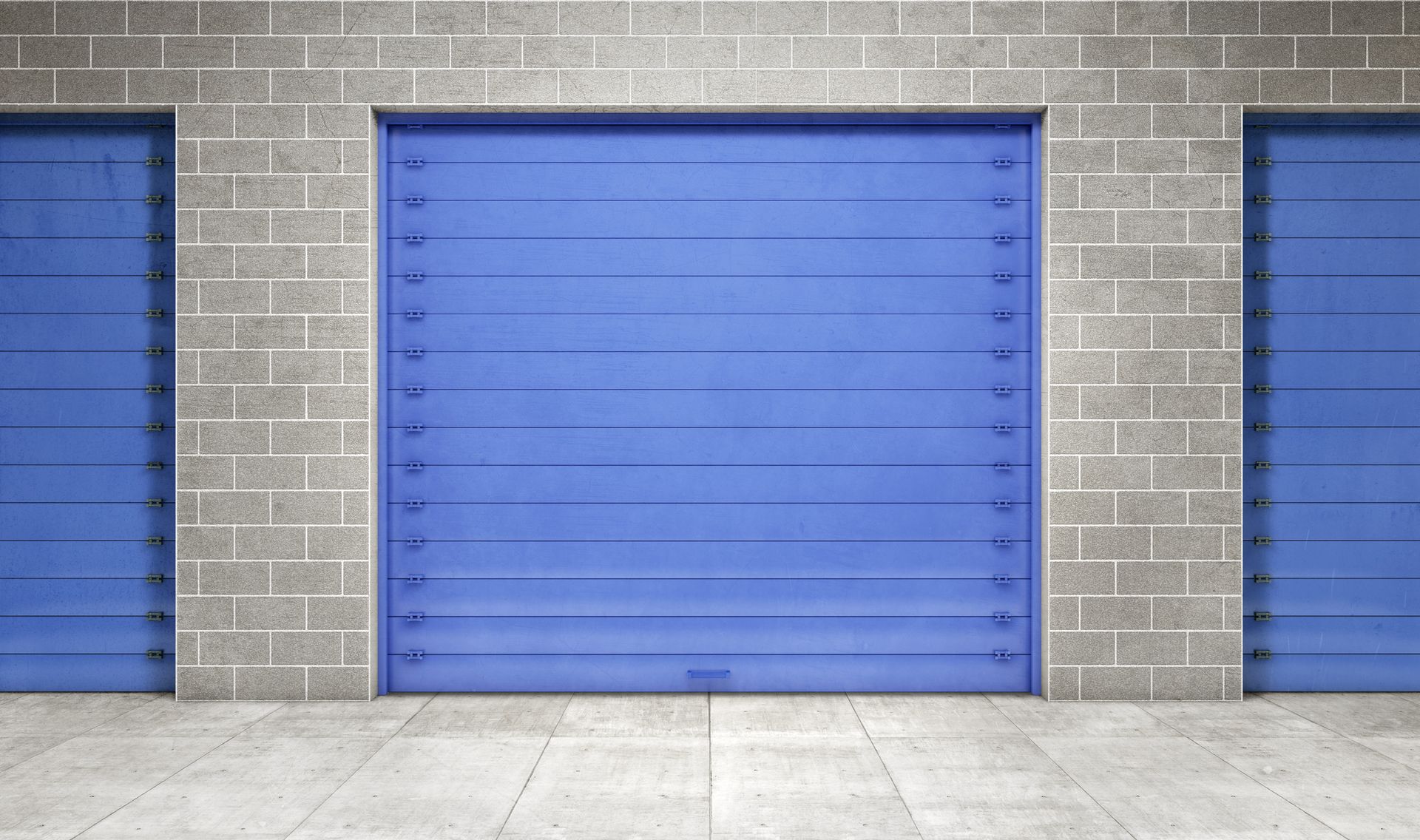 A row of self storage units with blue doors on a brick wall – Springfield, OR - 42nd St Mini Storage